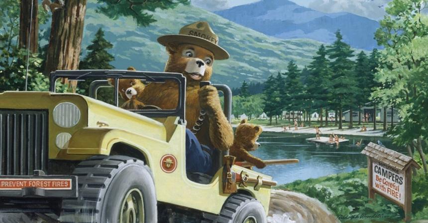 Smokey Bear, an anthropomorphic brown bear in a US Park Service Ranger hat, signals that the campers behind him are being safe with fire with the radio in his Jeep. [This image is a crop of the painting "Ten Four, Green and Clear" by Rachel Donahue.]