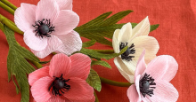 A bouquet of flowers made from round, crinkled pieces of tissue paper.