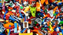A messy pile of miscellaneous Lego bricks in various shapes and colors.
