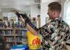 Presenter James McNamara holds a small alligator